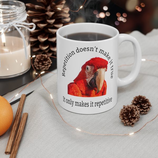 Repetition Doesn't Make It True mug with orange parrot