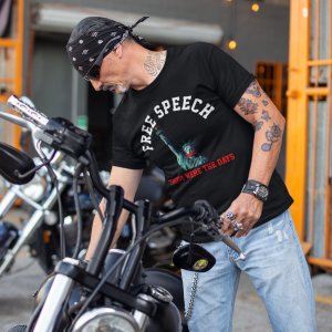 t-shirt-mockup-of-a-middle-aged-biker-fixing-his-motorcycle-s-seat-20245a